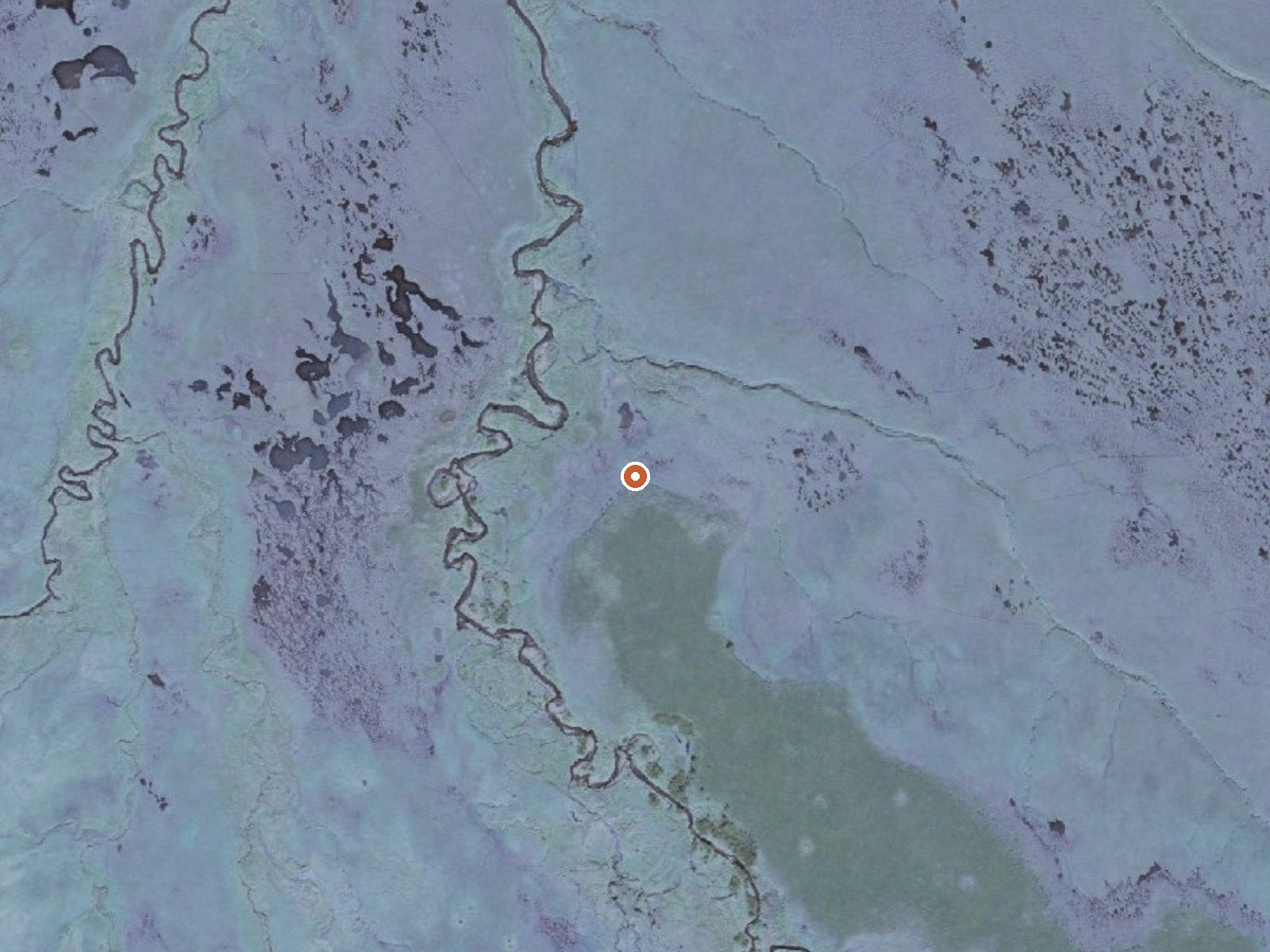 Aerial view of the ground around Haanĝux̂ Cold Bay Hot Springs