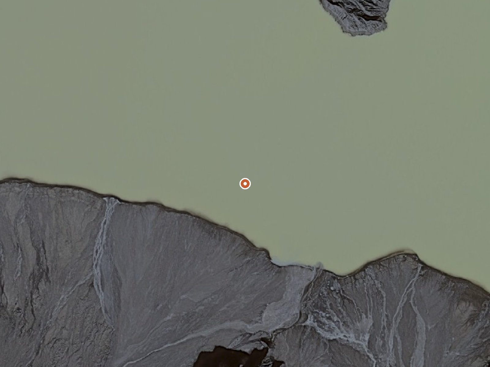 Aerial view of the ground around Thermal Springs In Okmok Caldera