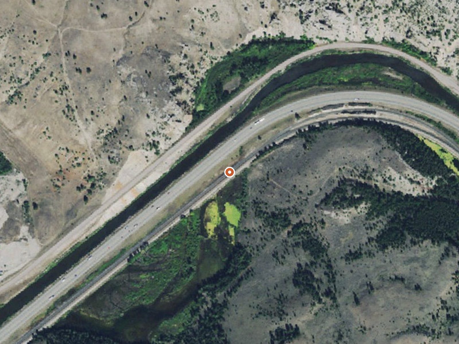 Aerial view of the ground around Bearmouth Warm Spring 1