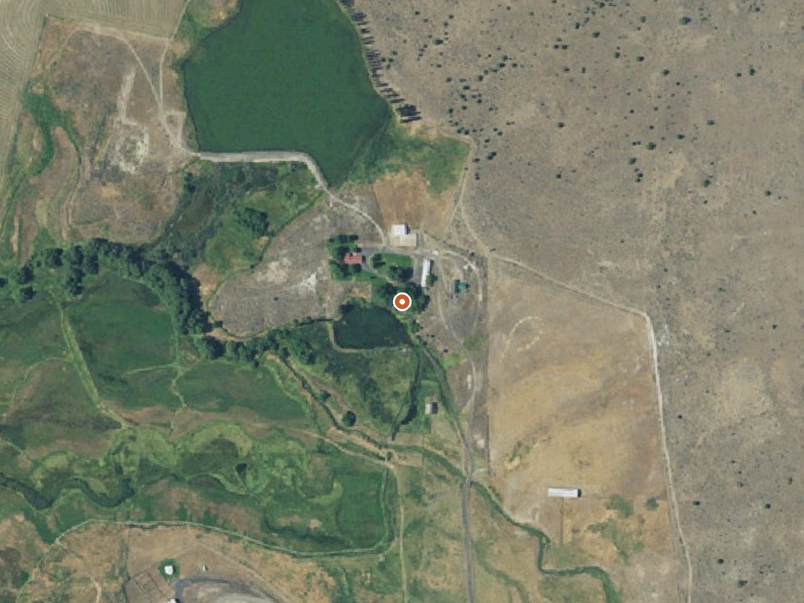 Aerial view of the ground around Altnow Hot Spring