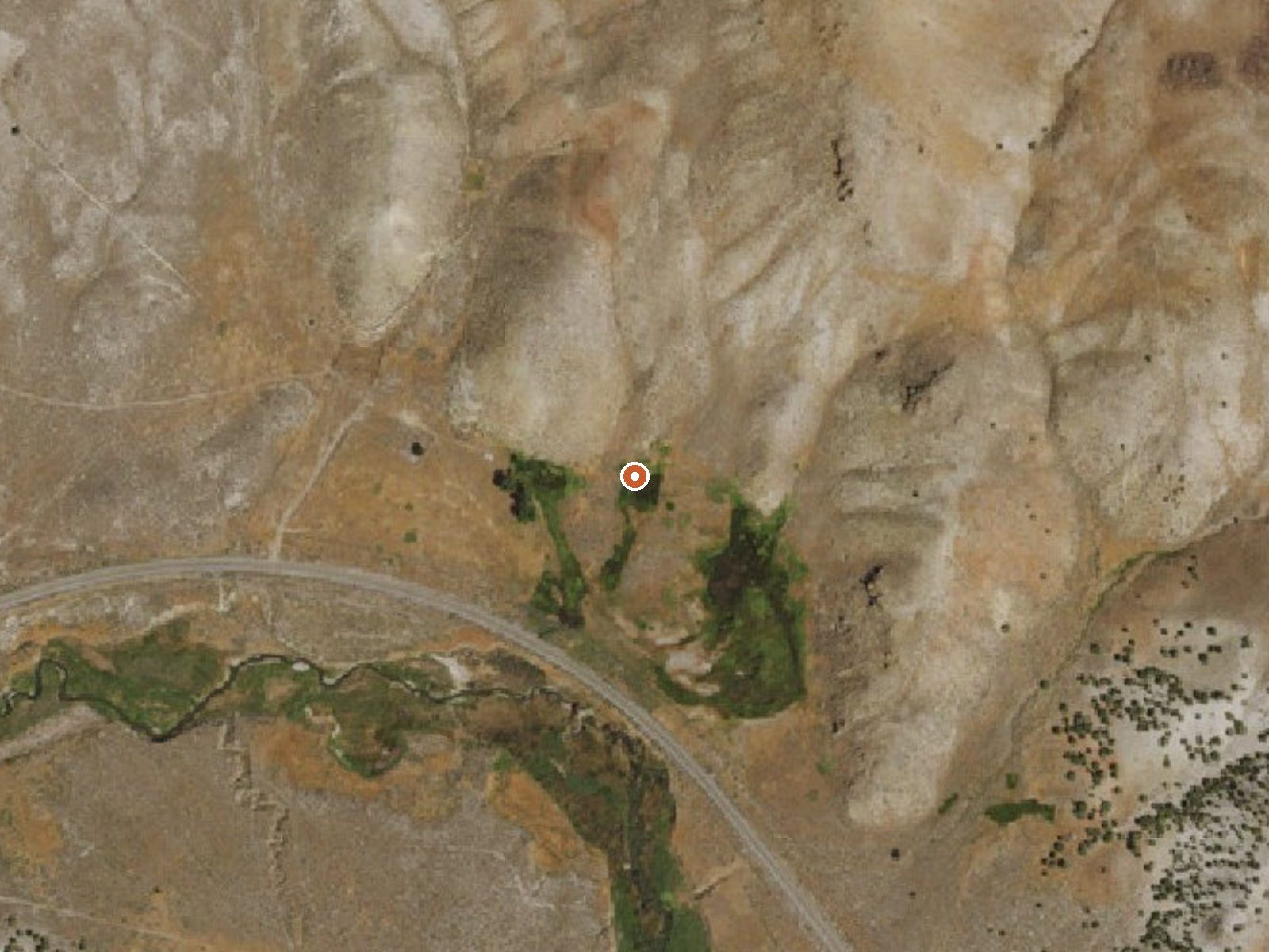 Aerial view of the ground around Raine Ranch Springs