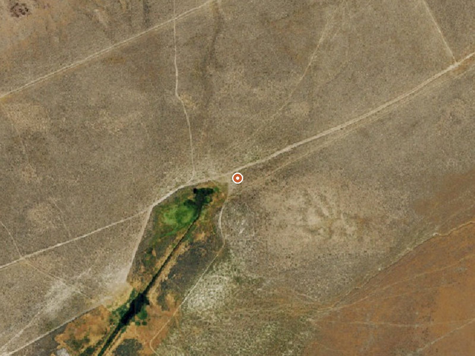 Aerial view of the ground around Izzenhood Ranch Springs