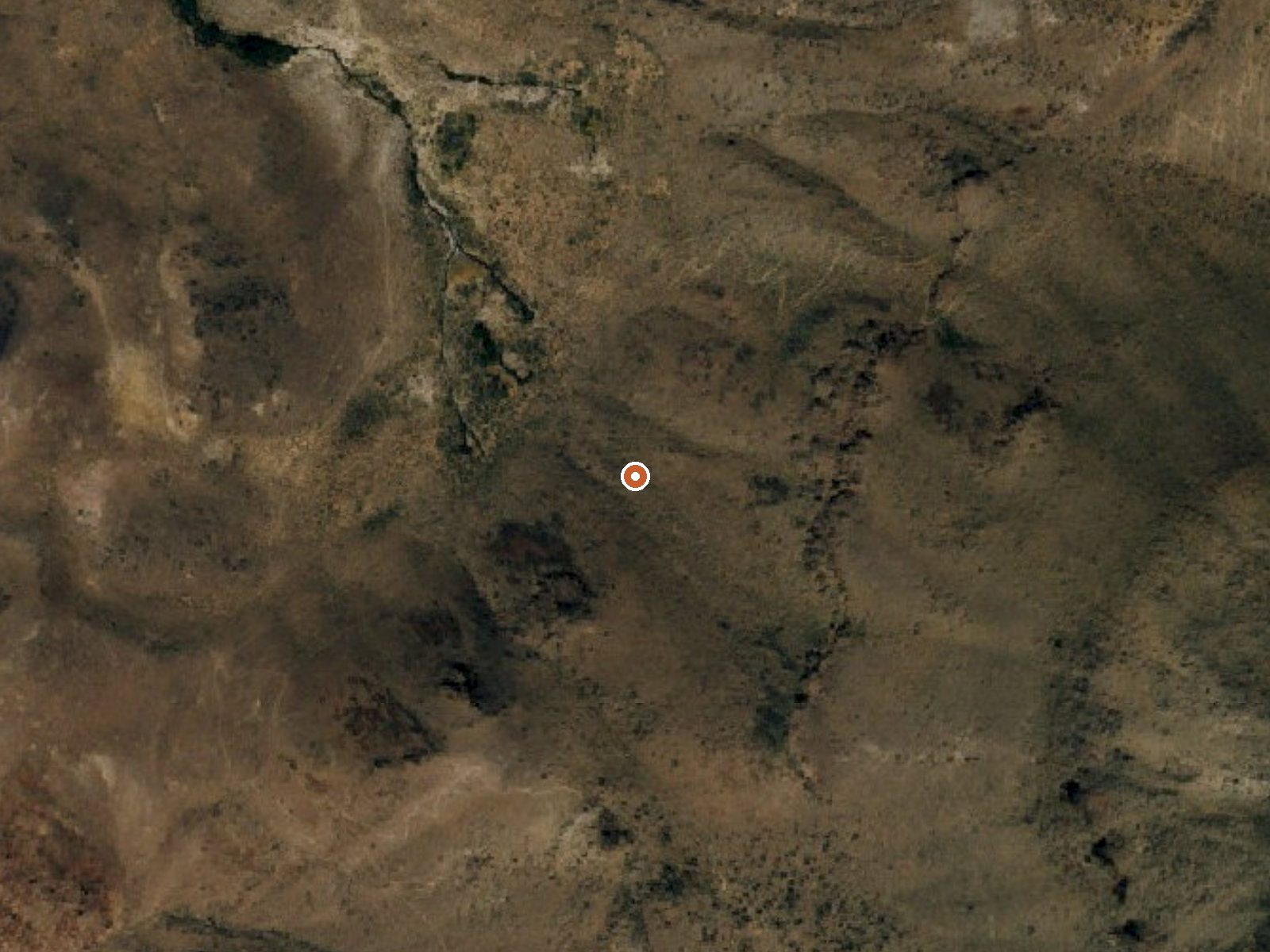 Aerial view of the ground around Mustang Springs