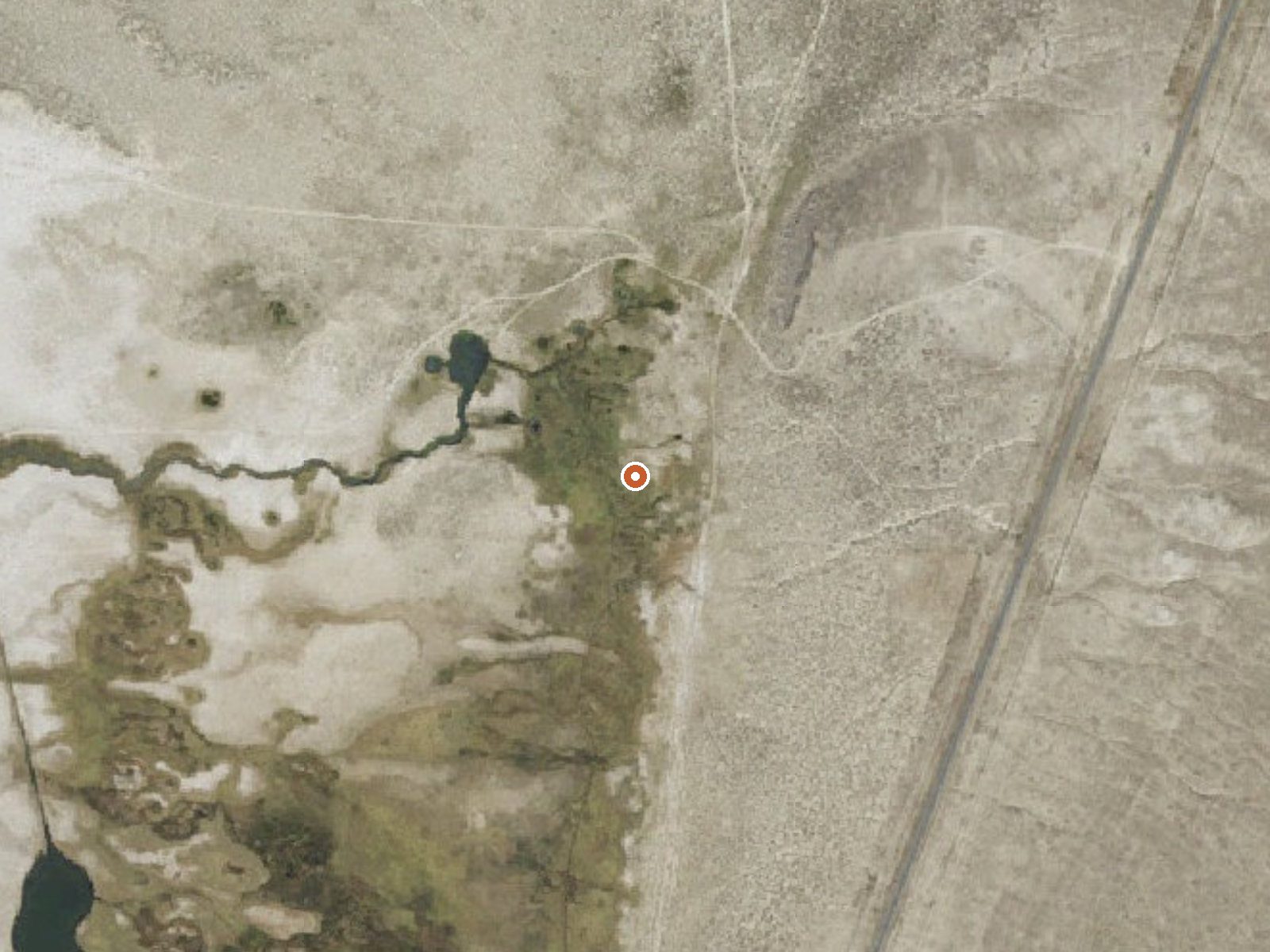 Aerial view of the ground around Deseret Livestock South Springs